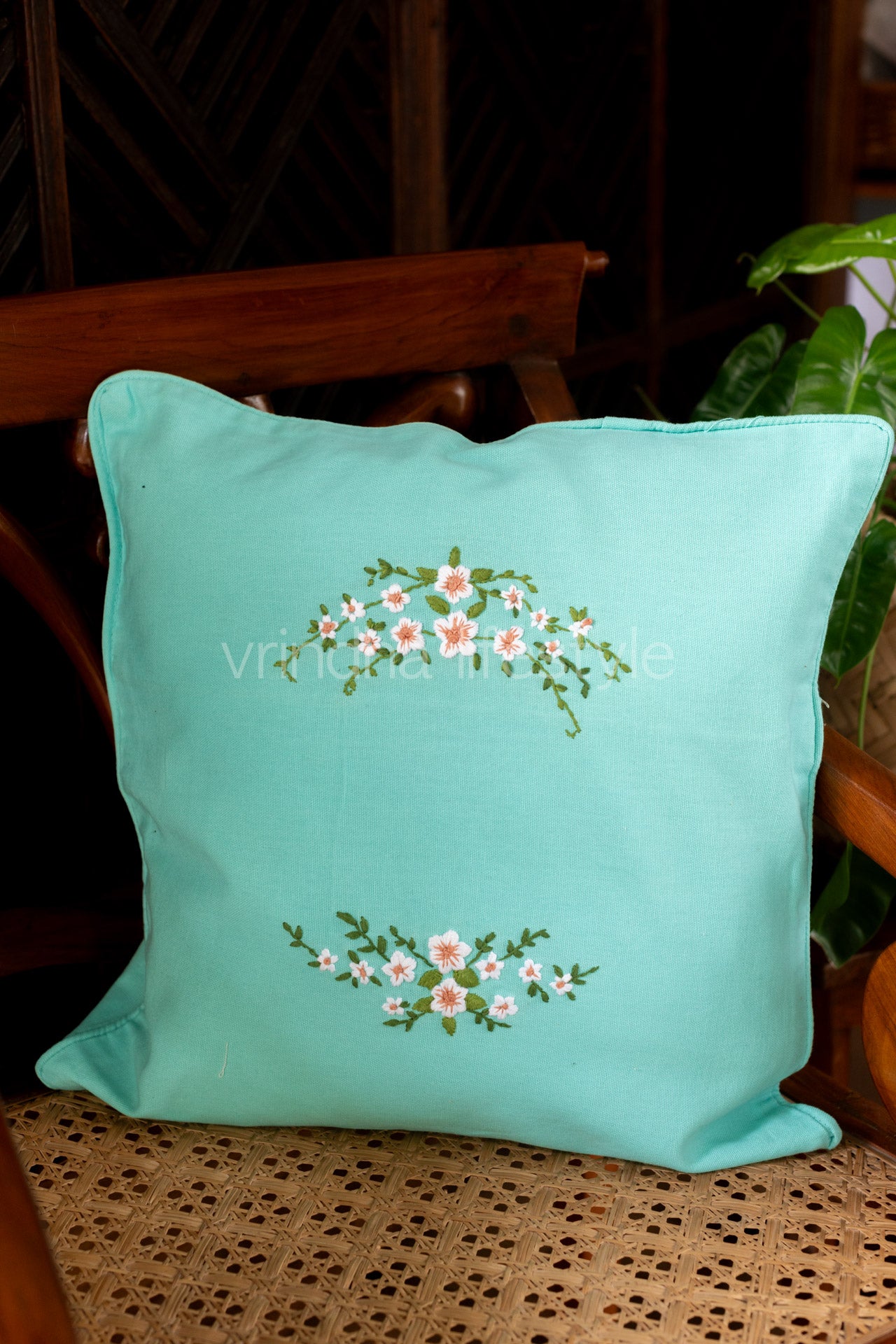 Hand embroidered cushion cover