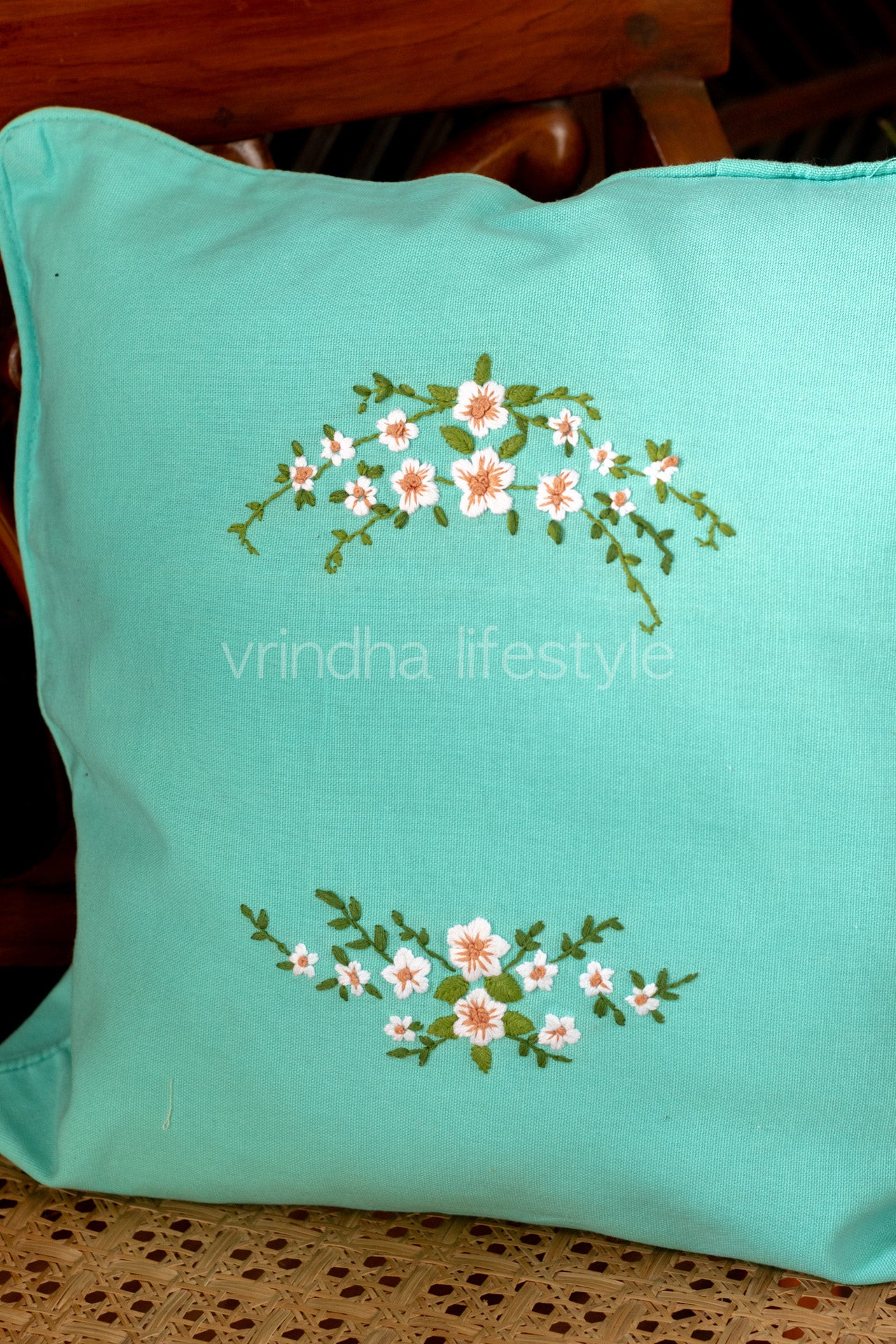 Hand embroidered cushion cover