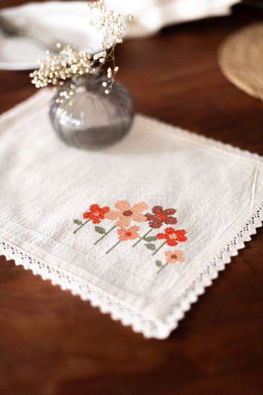 Cotton slub table mat with cross stitch embroidery and lace detailing