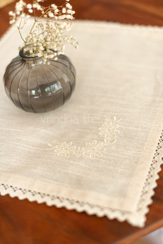 Cotton slub table mat with cross stitch embroidery and lace detailing