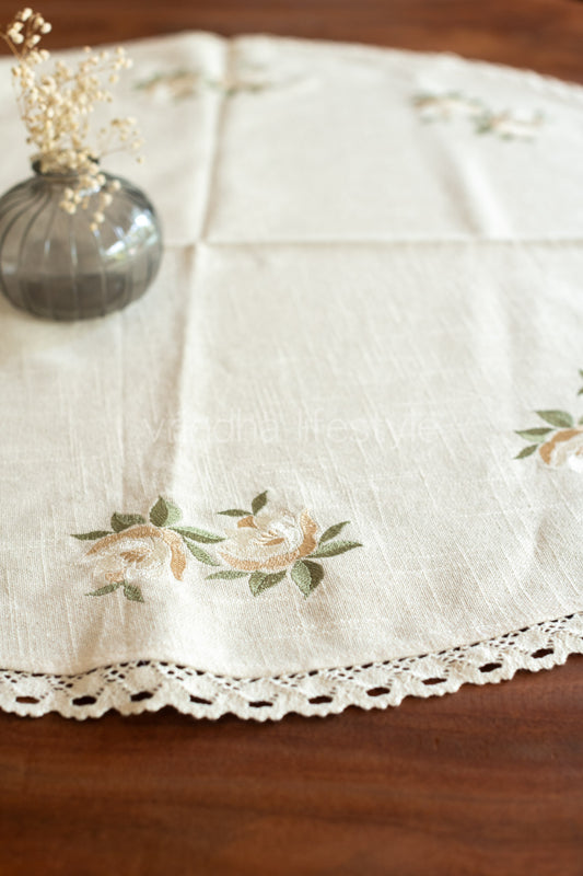 Coffee table cover with embroidery and lace detailing