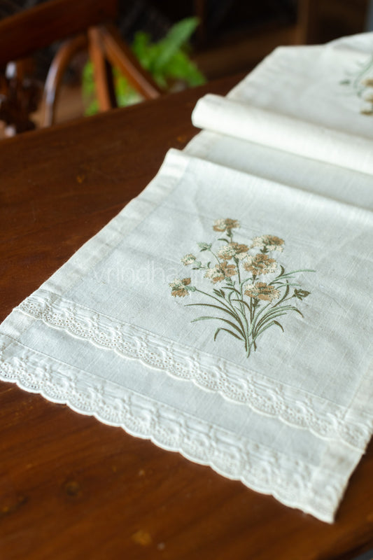 Cotton table runner with embroidery and lace detailing