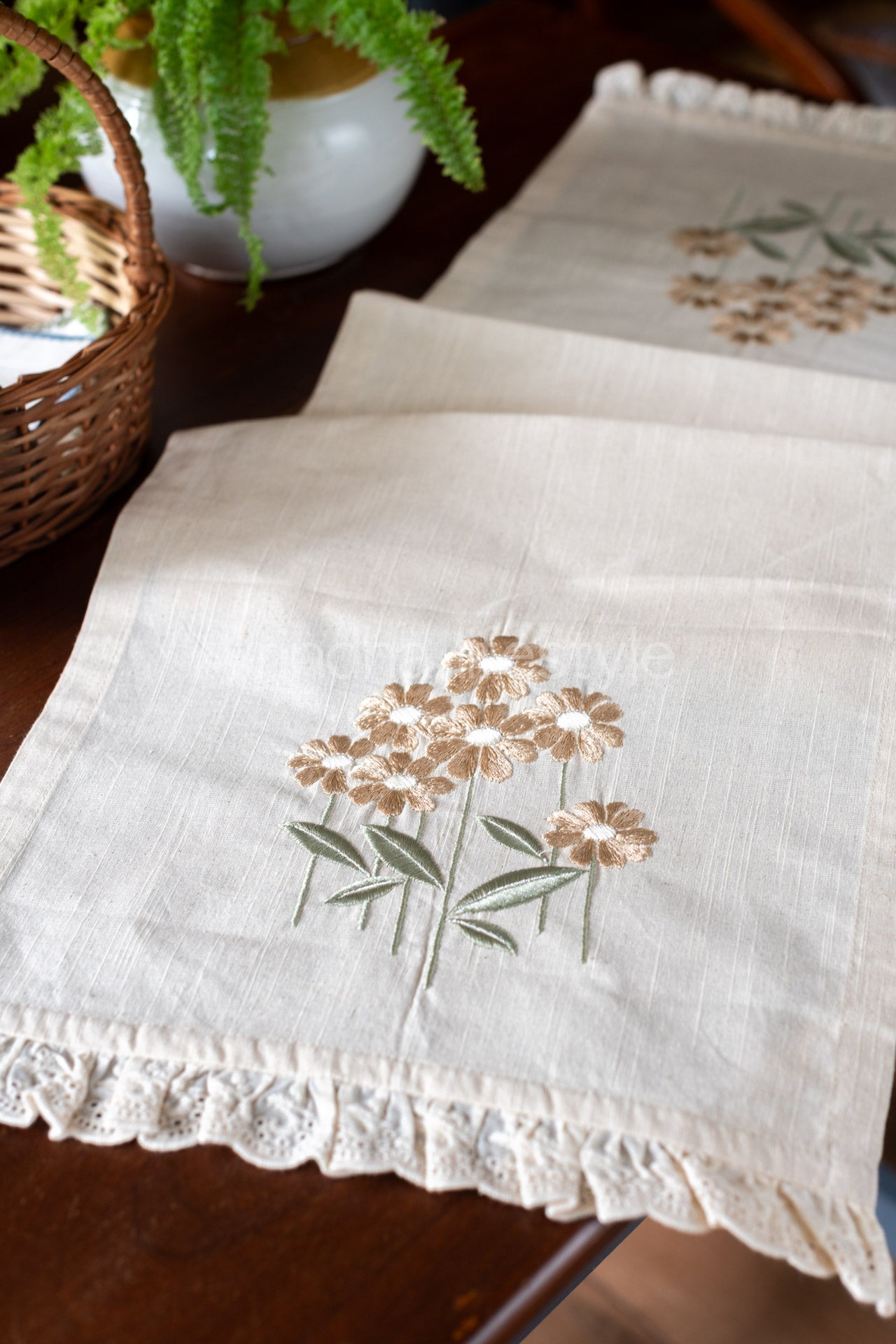 Cotton table runner with embroidery and lace detailing