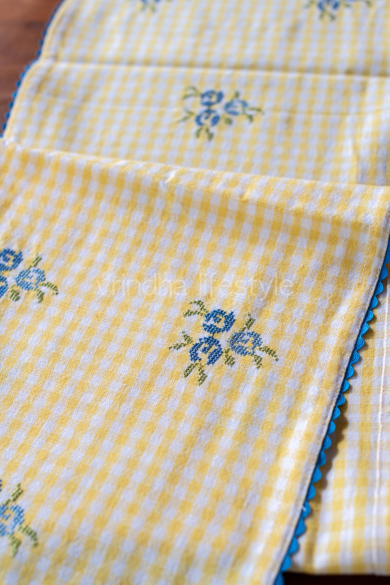 Cotton table runner with floral embroidery and lace detailing11.5x54 inches