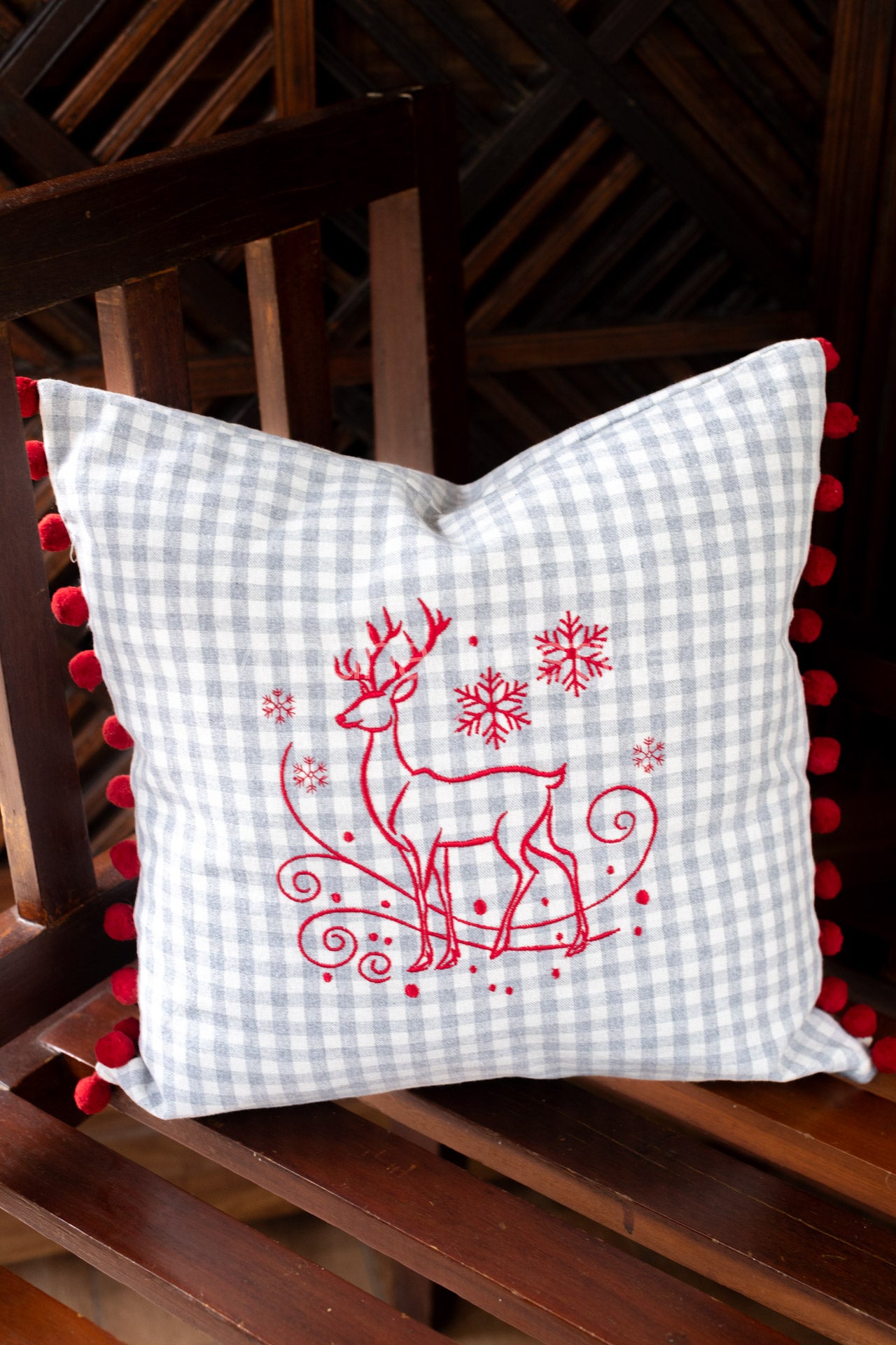 Cotton cushion cover with embroidery and  pom poms