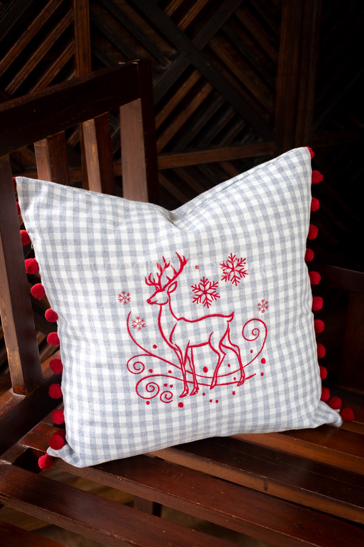 Cotton cushion cover with embroidery and  pom poms
