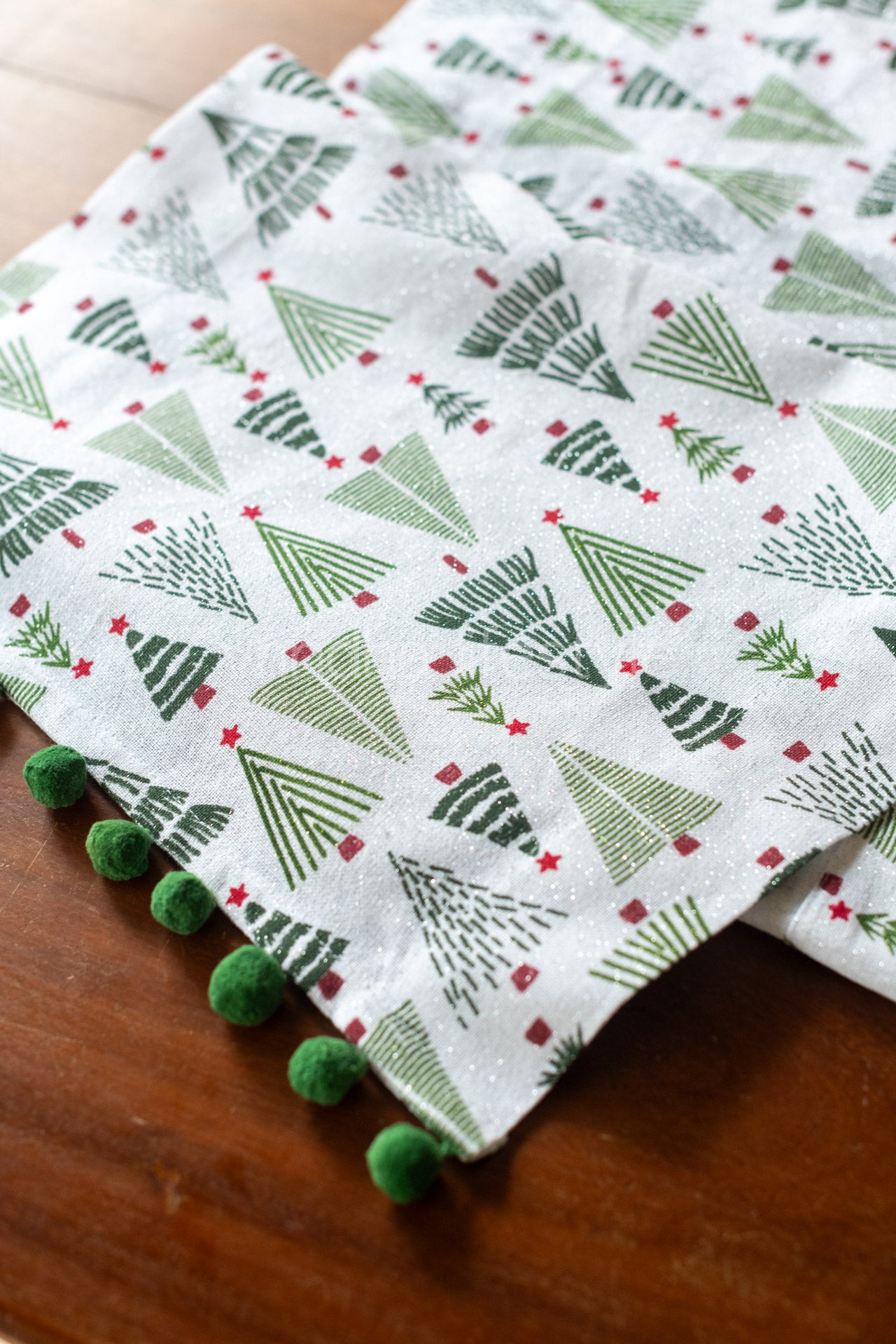 Printed cotton lurex table runner with  pom poms